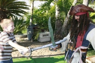 sword fighting game and sword training at a pirate theme birthday party