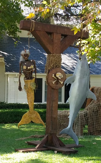 gallows with fiji mermaid and great white shark prop for rent