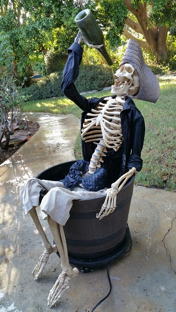 pirate skeleton drinking from a bottle fountain display